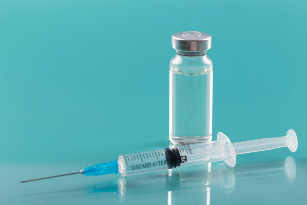 coronavirus arrangement with vaccine bottle syringe (1)